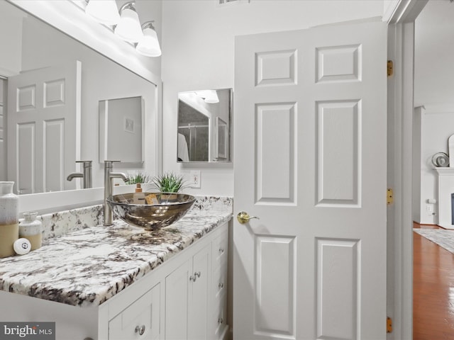 1521 Spring Gate Dr Unit 10308, Mclean, VA 22102 - bathroom featuring vanity and wood finished floors