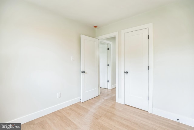 4 Donna Marie Ct, Sicklerville, NJ 08081 - unfurnished bedroom featuring baseboards, light wood finished floors, and a closet