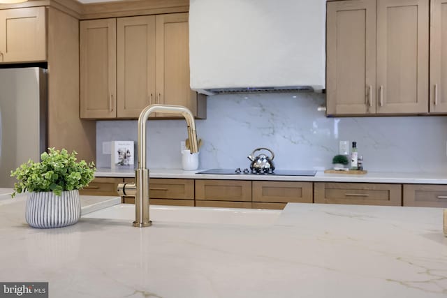 2655 Gap Newport Pike, West Grove, PA 19390 - kitchen featuring freestanding refrigerator, decorative backsplash, light stone countertops, and a sink