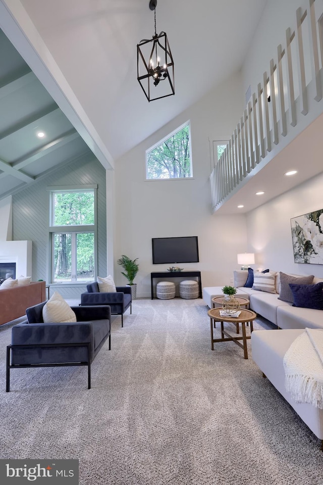 2655 Gap Newport Pike, West Grove, PA 19390 - carpeted living area featuring high vaulted ceiling, a chandelier, and a glass covered fireplace
