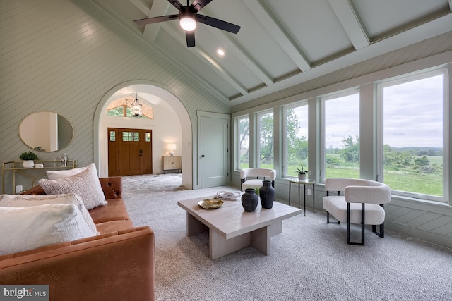 2655 Gap Newport Pike, West Grove, PA 19390 - carpeted living area with beamed ceiling, arched walkways, wooden walls, a ceiling fan, and high vaulted ceiling