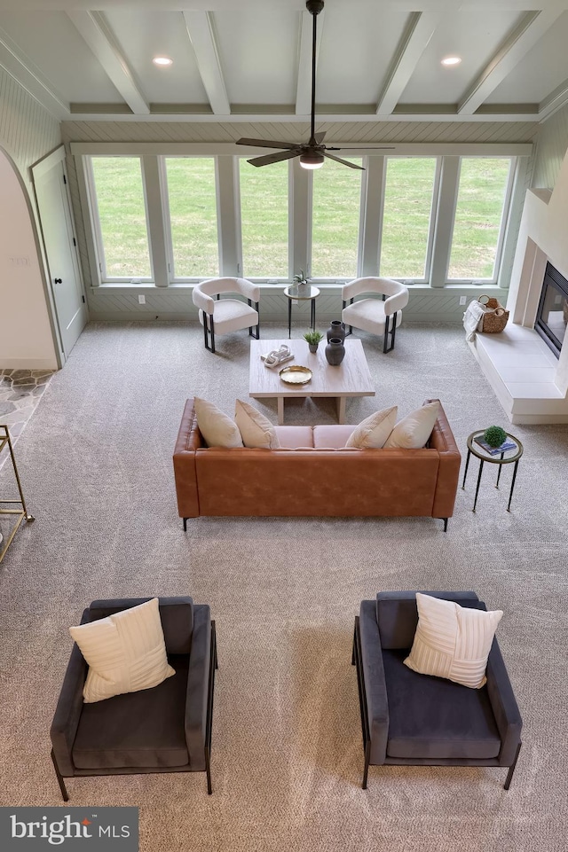 2655 Gap Newport Pike, West Grove, PA 19390 - carpeted living area featuring plenty of natural light, beamed ceiling, ceiling fan, a glass covered fireplace, and coffered ceiling
