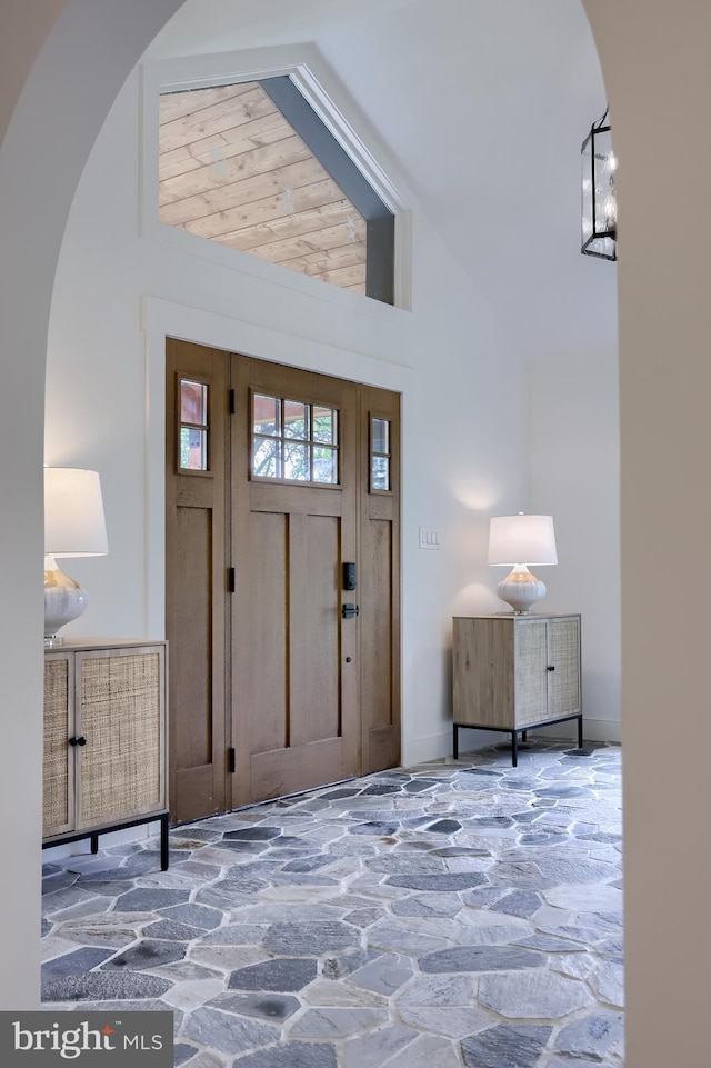 2655 Gap Newport Pike, West Grove, PA 19390 - foyer entrance featuring stone floors, arched walkways, and high vaulted ceiling