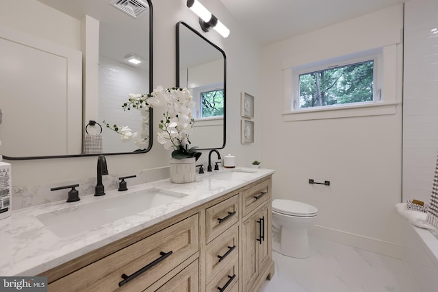 2655 Gap Newport Pike, West Grove, PA 19390 - full bathroom featuring double vanity, marble finish flooring, toilet, baseboards, and a bath