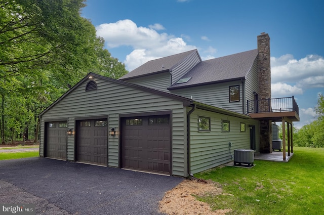 2655 Gap Newport Pike, West Grove, PA 19390 - view of property exterior featuring central air condition unit, a balcony, an attached garage, and a chimney