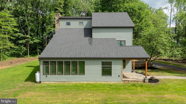 2655 Gap Newport Pike, West Grove, PA 19390 - rear view of house featuring a chimney, a yard, and a shingled roof