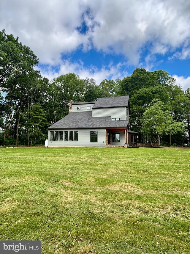 2655 Gap Newport Pike, West Grove, PA 19390 - back of property with a yard, roof with shingles, and view of scattered trees