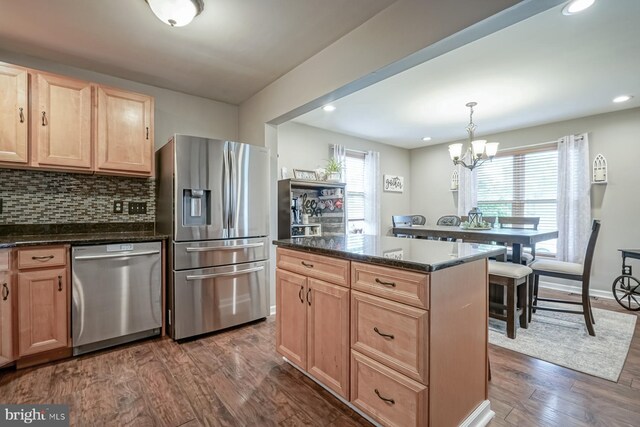 666 Bridgeton Park, Mantua, NJ 08051 - kitchen featuring appliances with stainless steel finishes, light brown cabinets, dark wood-type flooring, a chandelier, and decorative backsplash