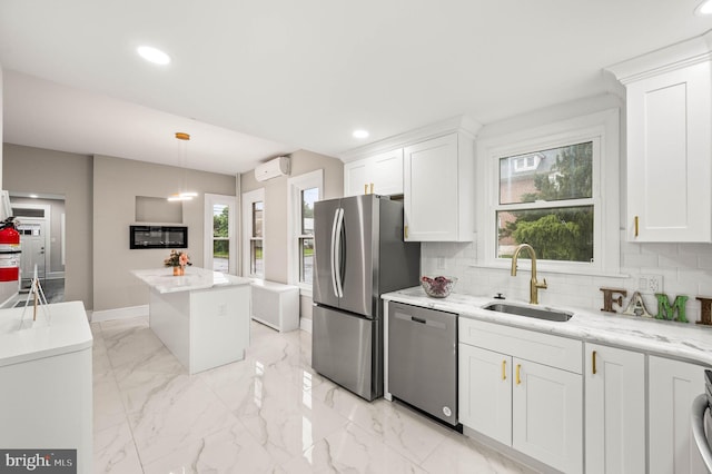 552 Willow St, Pottstown, PA 19464 - kitchen featuring appliances with stainless steel finishes, a sink, an AC wall unit, plenty of natural light, and recessed lighting