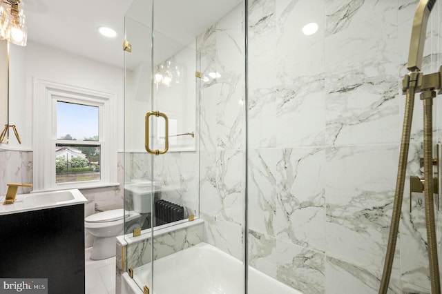552 Willow St, Pottstown, PA 19464 - full bathroom featuring toilet, vanity, tile walls, a wainscoted wall, and shower / bath combination with glass door