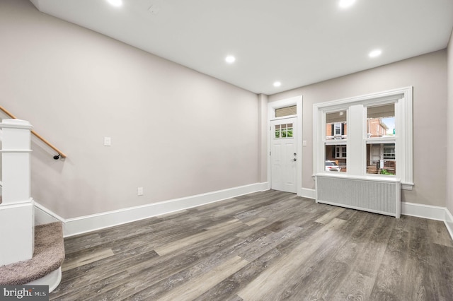 552 Willow St, Pottstown, PA 19464 - foyer entrance featuring wood finished floors, stairs, baseboards, recessed lighting, and radiator heating unit