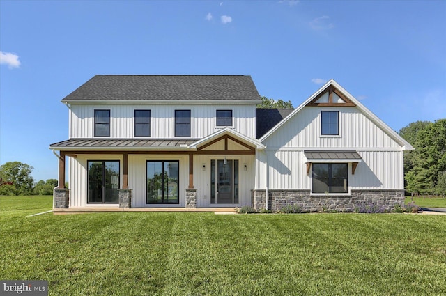 104 Lightfoot Ln, Dillsburg, PA 17019 - back of property featuring a standing seam roof, stone siding, and metal roof