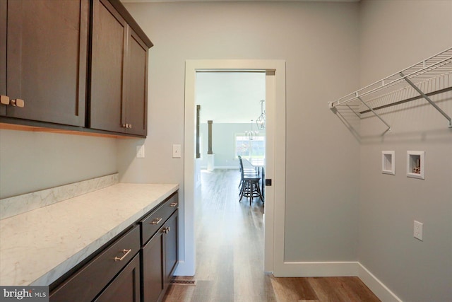 104 Lightfoot Ln, Dillsburg, PA 17019 - laundry room with wood finished floors, cabinet space, washer hookup, and baseboards