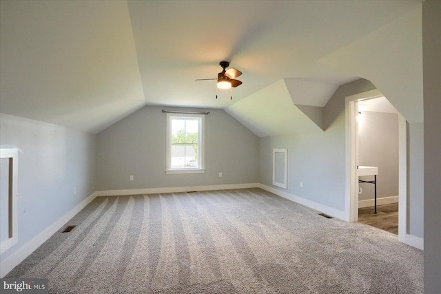 104 Lightfoot Ln, Dillsburg, PA 17019 - additional living space with carpet, a ceiling fan, baseboards, and lofted ceiling
