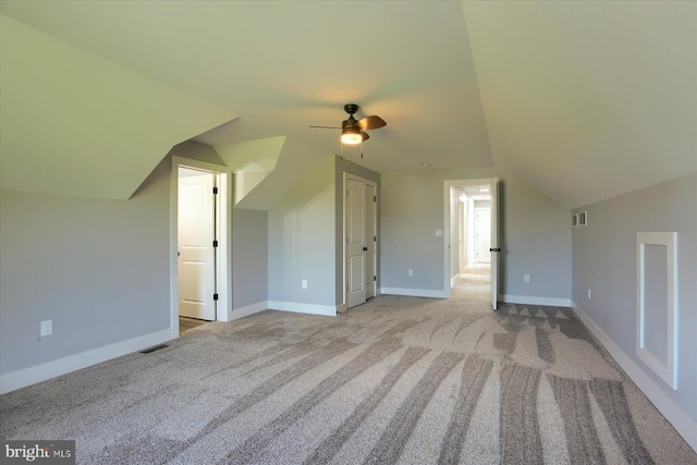 104 Lightfoot Ln, Dillsburg, PA 17019 - additional living space with carpet floors, ceiling fan, vaulted ceiling, and baseboards