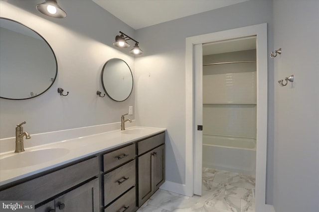 104 Lightfoot Ln, Dillsburg, PA 17019 - full bathroom featuring marble look tile flooring, double vanity, bathtub / shower combination, and baseboards