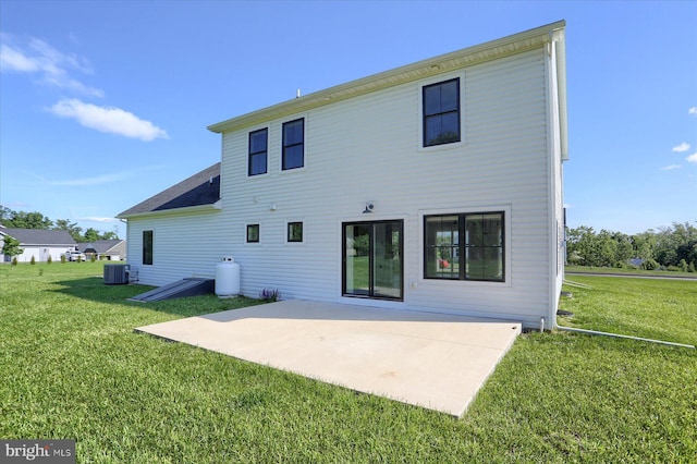 104 Lightfoot Ln, Dillsburg, PA 17019 - rear view of house with cooling unit, a patio, and a lawn