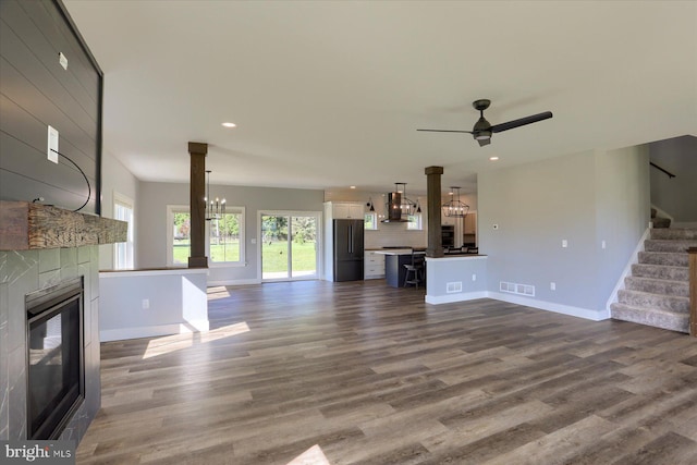 104 Lightfoot Ln, Dillsburg, PA 17019 - unfurnished living room featuring a fireplace, ceiling fan, stairs, recessed lighting, and dark wood finished floors