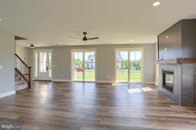 104 Lightfoot Ln, Dillsburg, PA 17019 - unfurnished living room with plenty of natural light, a fireplace, stairs, recessed lighting, and a ceiling fan