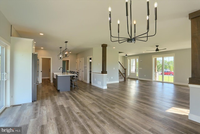 104 Lightfoot Ln, Dillsburg, PA 17019 - unfurnished living room with a chandelier, dark wood-style floors, ceiling fan, baseboards, and recessed lighting