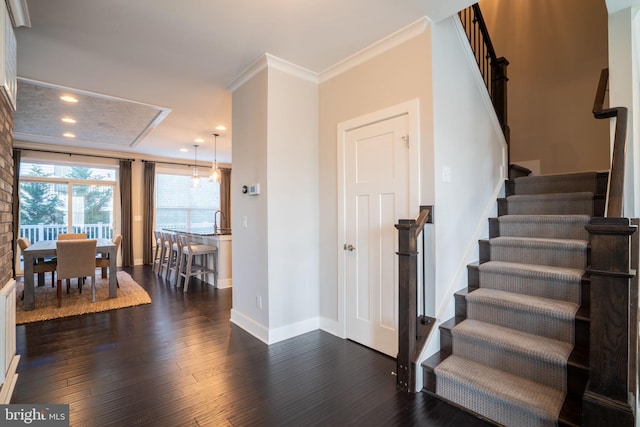 22270 Foggy Ridge Ter, Ashburn, VA 20148 - stairway featuring crown molding, hardwood / wood-style floors, baseboards, and recessed lighting