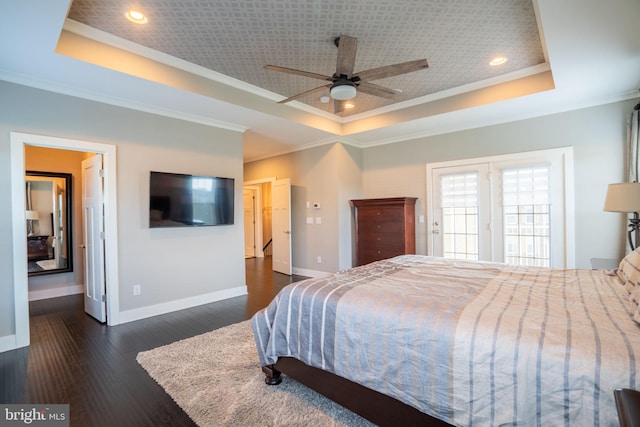22270 Foggy Ridge Ter, Ashburn, VA 20148 - bedroom featuring a tray ceiling, crown molding, baseboards, dark wood finished floors, and recessed lighting