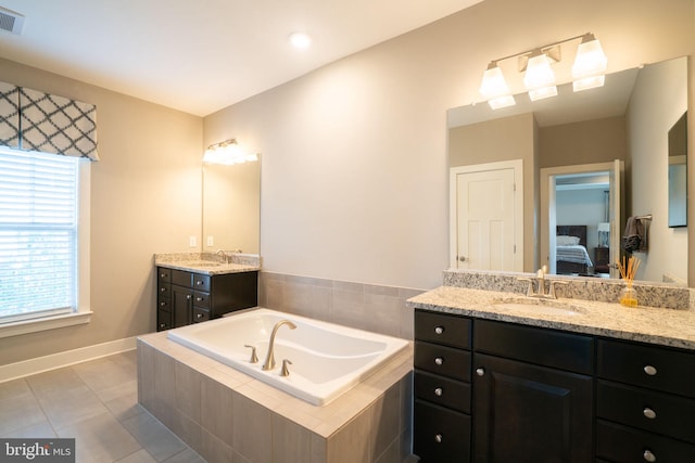 22270 Foggy Ridge Ter, Ashburn, VA 20148 - bathroom with ensuite bathroom, a garden tub, two vanities, and plenty of natural light