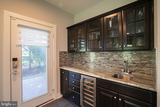 22270 Foggy Ridge Ter, Ashburn, VA 20148 - indoor wet bar featuring wine cooler, tasteful backsplash, and dark tile patterned floors