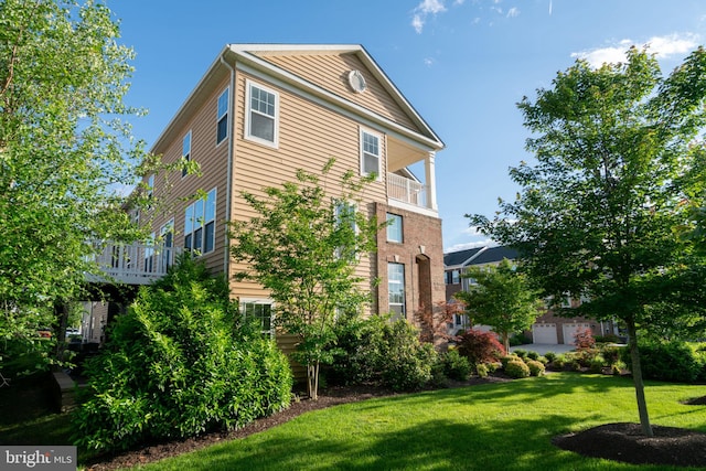 22270 Foggy Ridge Ter, Ashburn, VA 20148 - view of side of property featuring a yard and a balcony