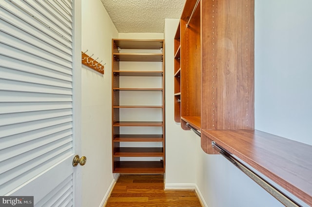 1101 S Arlington Ridge Rd Unit 216, Arlington, VA 22202 - walk in closet with wood finished floors