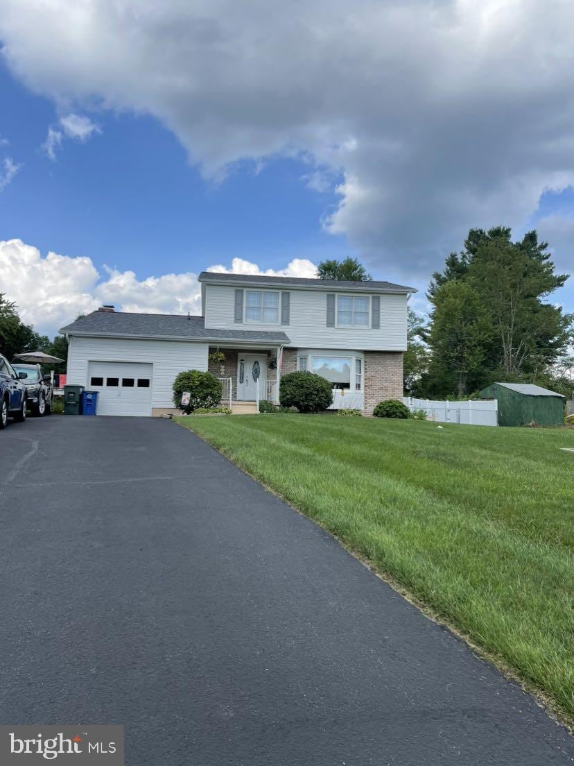 2419 Plainhurst Way, Reisterstown, MD 21136 - view of front of property featuring a garage and asphalt driveway