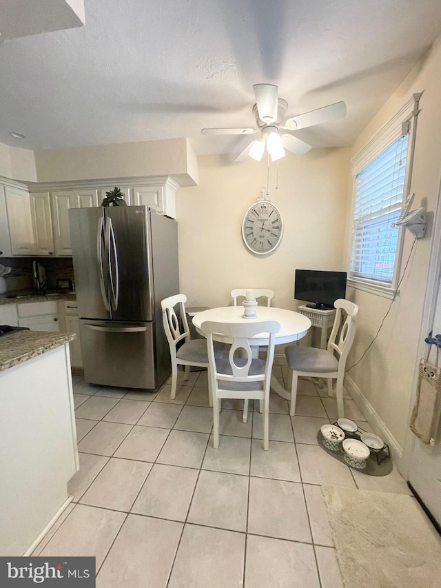 1820 S Dover St, Philadelphia, PA 19145 - dining area featuring light tile patterned floors, ceiling fan, and baseboards