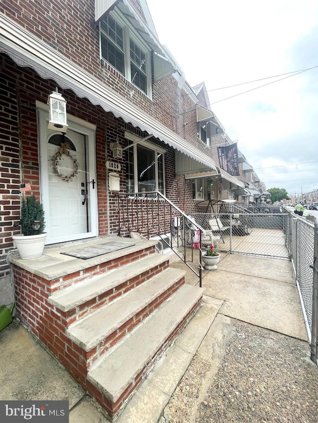 1820 S Dover St, Philadelphia, PA 19145 - property entrance featuring brick siding