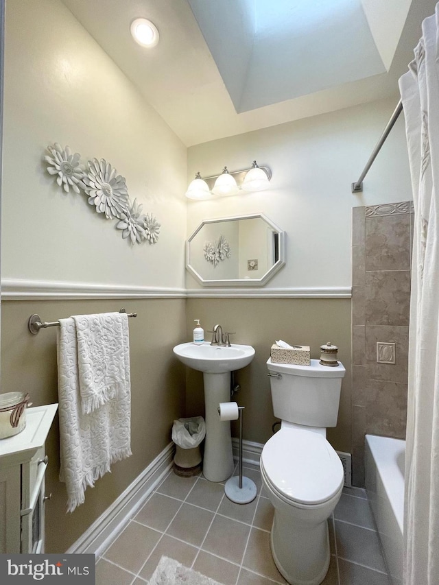 1820 S Dover St, Philadelphia, PA 19145 - full bathroom with toilet, tile patterned floors, shower / tub combo with curtain, baseboards, and a sink