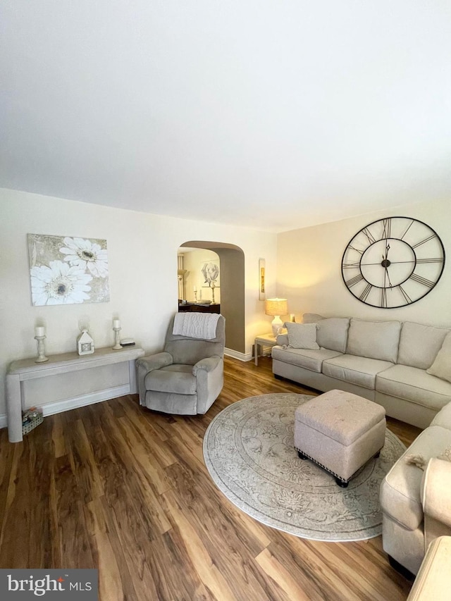 1820 S Dover St, Philadelphia, PA 19145 - living room with arched walkways and wood finished floors