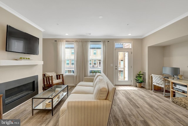 45210 Lettermore Sq, Sterling, VA 20166 - living room featuring crown molding, wood finished floors, a fireplace, baseboards, and recessed lighting