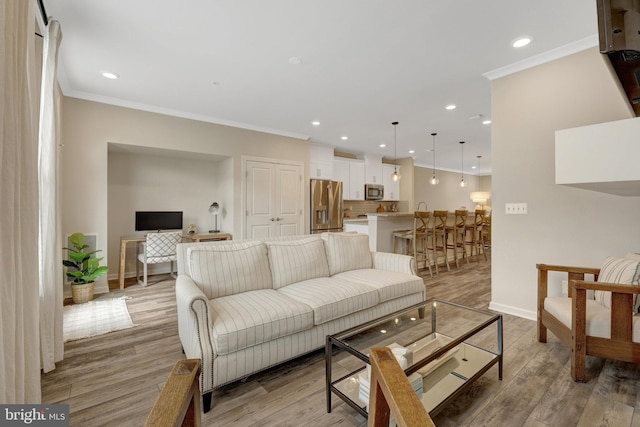 45210 Lettermore Sq, Sterling, VA 20166 - living area featuring crown molding, baseboards, recessed lighting, and light wood-style floors