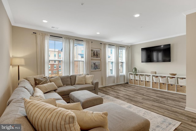 45210 Lettermore Sq, Sterling, VA 20166 - living area featuring crown molding, wood finished floors, baseboards, and recessed lighting