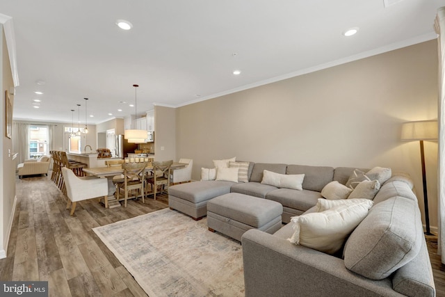 45210 Lettermore Sq, Sterling, VA 20166 - living area with light wood-style flooring, recessed lighting, and crown molding
