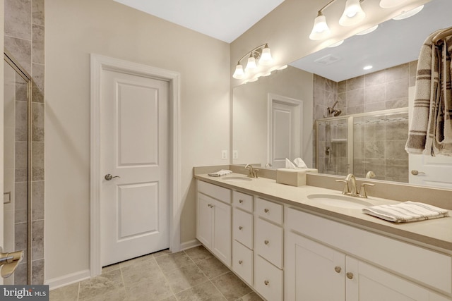 45210 Lettermore Sq, Sterling, VA 20166 - bathroom with double vanity, a shower stall, baseboards, and tile patterned floors