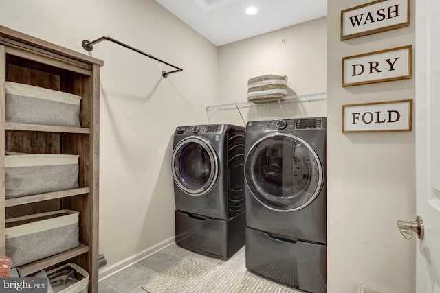45210 Lettermore Sq, Sterling, VA 20166 - laundry room with washer and dryer, baseboards, and tile patterned flooring