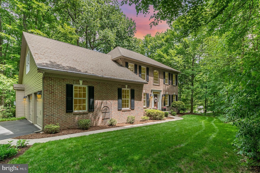 190 Stanley Dr, Palmyra, PA 17078 - colonial inspired home featuring brick siding, driveway, a yard, and a shingled roof