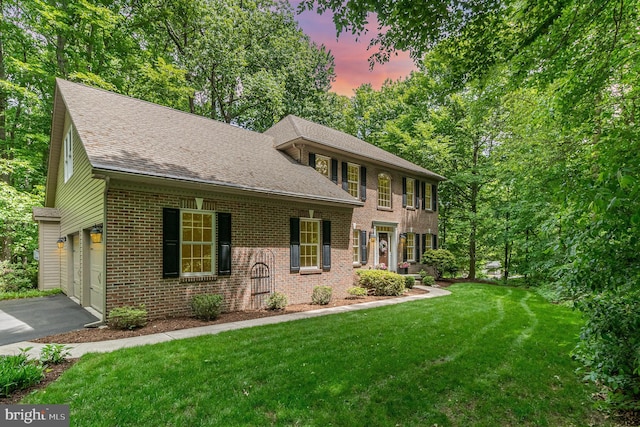 190 Stanley Dr, Palmyra, PA 17078 - colonial inspired home featuring brick siding, driveway, a yard, and a shingled roof