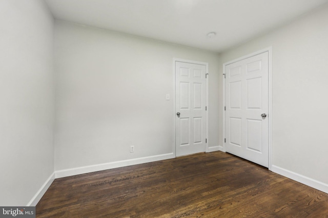 945 Ficklen Rd, Fredericksburg, VA 22405 - unfurnished bedroom with baseboards and dark wood-type flooring