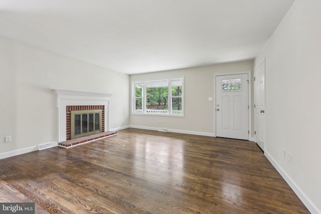 945 Ficklen Rd, Fredericksburg, VA 22405 - unfurnished living room featuring wood finished floors, a fireplace, and baseboards