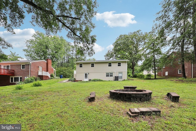 945 Ficklen Rd, Fredericksburg, VA 22405 - rear view of house featuring an outdoor fire pit and a yard