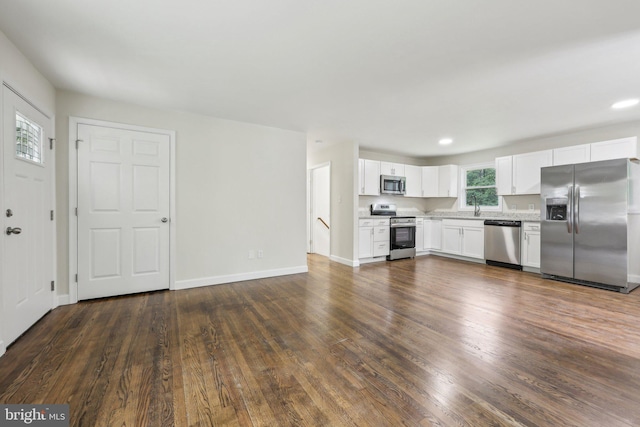 945 Ficklen Rd, Fredericksburg, VA 22405 - kitchen with stainless steel appliances, white cabinets, light countertops, dark wood-style floors, and recessed lighting