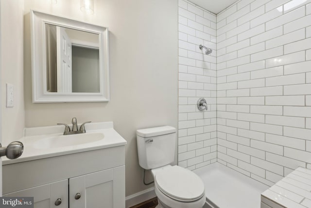 945 Ficklen Rd, Fredericksburg, VA 22405 - bathroom featuring tiled shower, vanity, and toilet