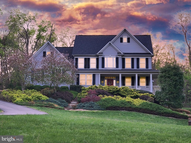 21785 Watson Rd, Leesburg, VA 20175 - view of front of house with covered porch, a yard, and a shingled roof