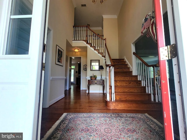 21785 Watson Rd, Leesburg, VA 20175 - foyer with stairs, wood finished floors, crown molding, and baseboards